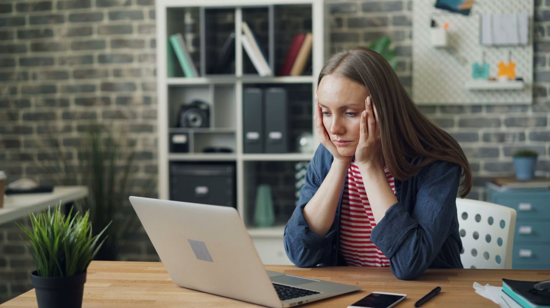 A stressed professional surrounded by clutter, reacting to one fire after another